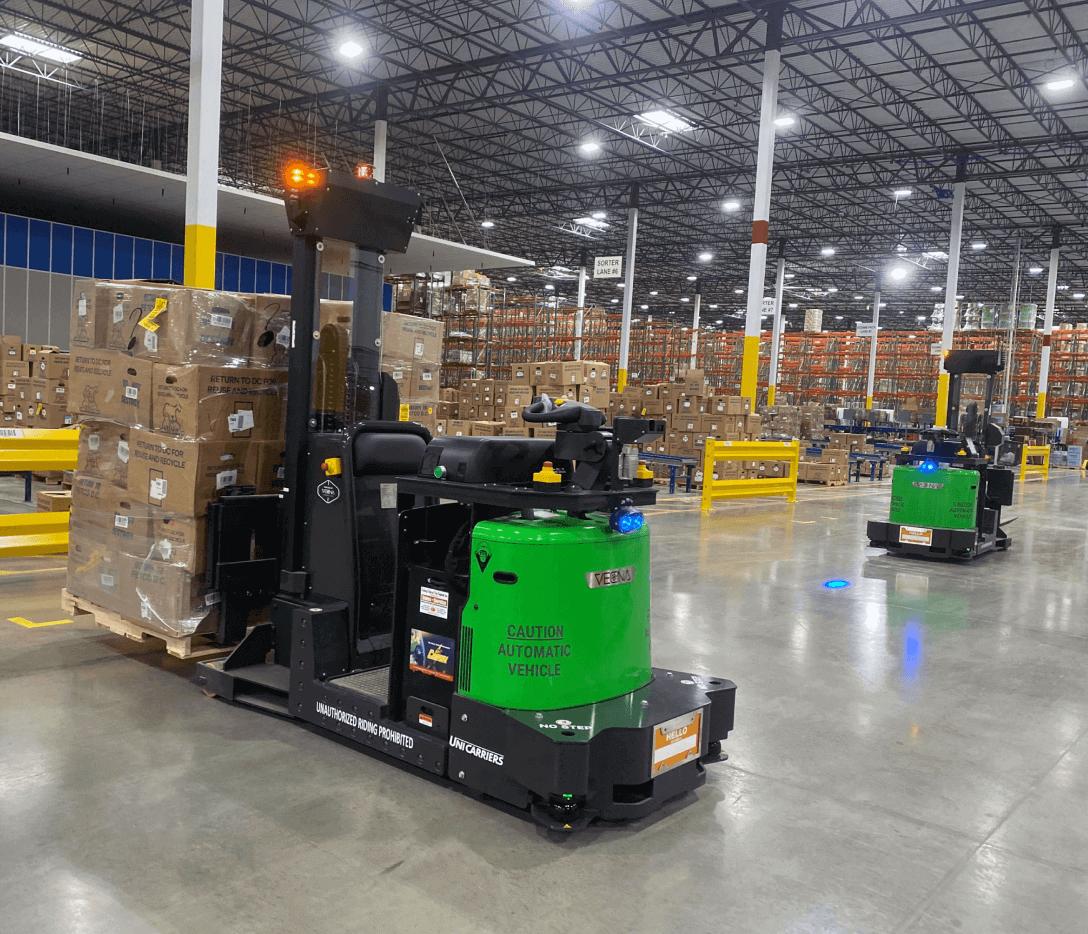 A photo of an AMR moving pallets