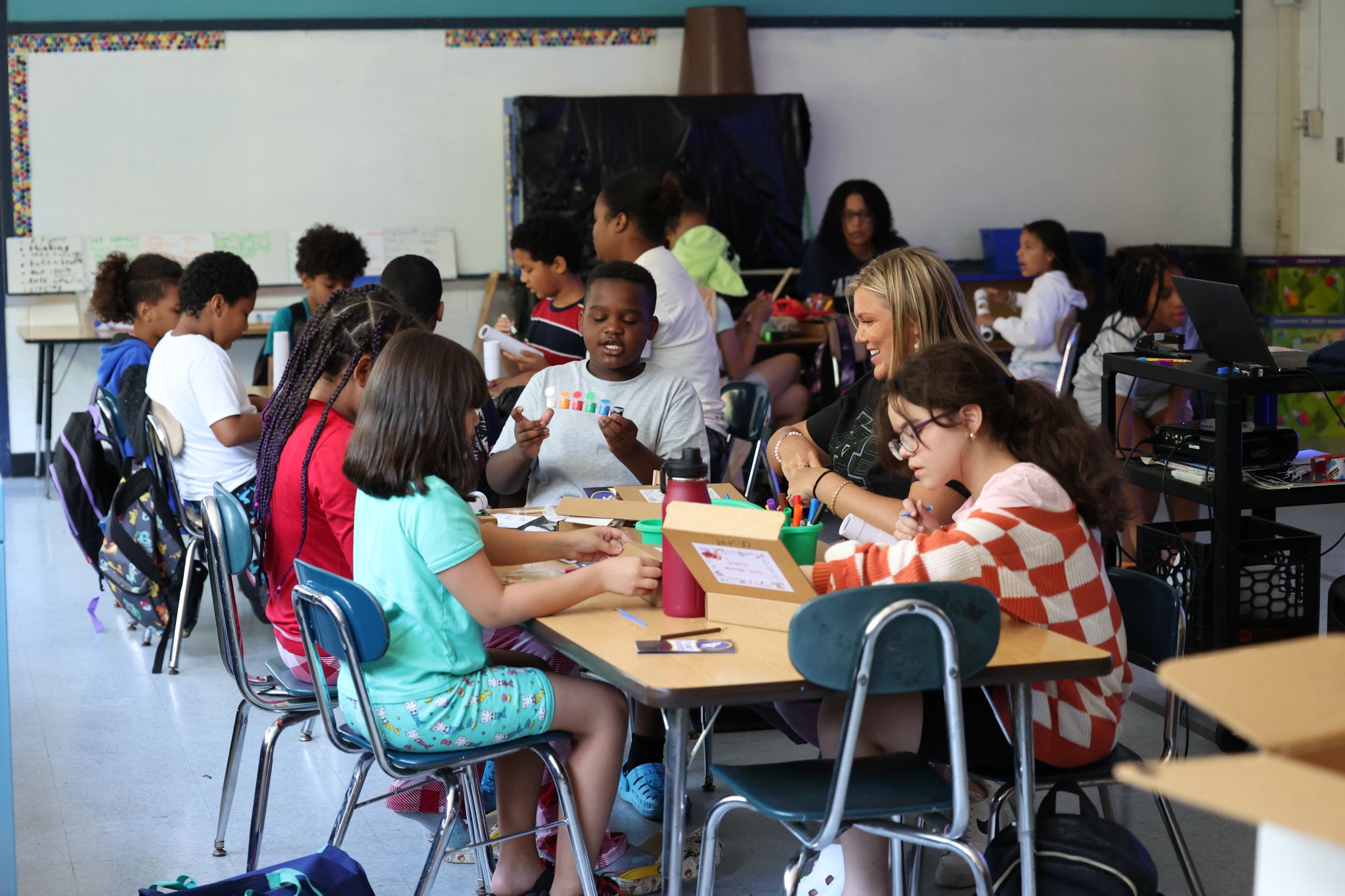 Group photo of kids doing art projects